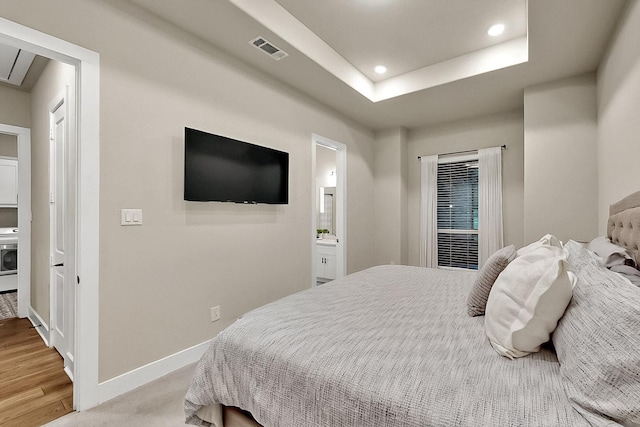 308 Secretariat, Hickory Creek, TX 75065 - bedroom featuring recessed lighting, baseboards, connected bathroom, and light wood-style floors