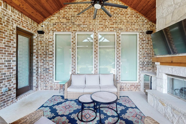 308 Secretariat, Hickory Creek, TX 75065 - living room featuring wooden ceiling, brick wall, lofted ceiling, ceiling fan, and carpet