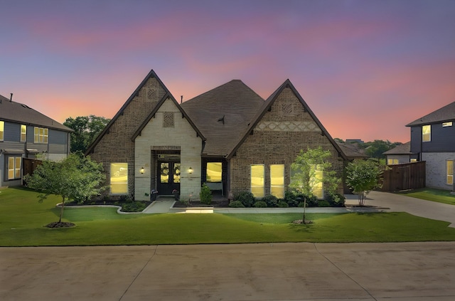 308 Secretariat, Hickory Creek, TX 75065 - view of front of home featuring brick siding, a front lawn, french doors, stone siding, and driveway