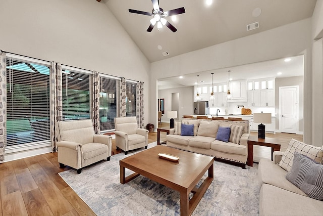 308 Secretariat, Hickory Creek, TX 75065 - living room with light wood finished floors, high vaulted ceiling, a ceiling fan, and recessed lighting