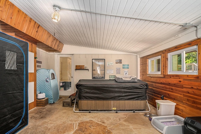 4151 Oakcrest Ln, Fort Worth, TX 76126 - bedroom with stone finish floors, wood walls, wooden ceiling, and vaulted ceiling