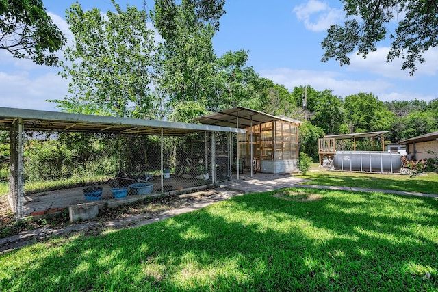 4151 Oakcrest Ln, Fort Worth, TX 76126 - view of grassy yard with an outdoor structure, a detached carport, and exterior structure