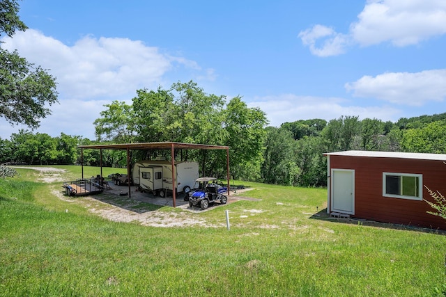 4151 Oakcrest Ln, Fort Worth, TX 76126 - view of green lawn featuring an outdoor structure, a detached carport, and a wooded view