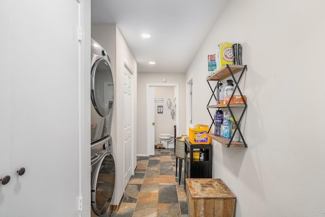 4151 Oakcrest Ln, Fort Worth, TX 76126 - laundry area featuring estacked washer and dryer, stone tile flooring, recessed lighting, and baseboards