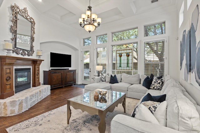 3063 Mitchell Way, The Colony, TX 75056 - living room with a towering ceiling, plenty of natural light, a chandelier, coffered ceiling, and ornamental molding