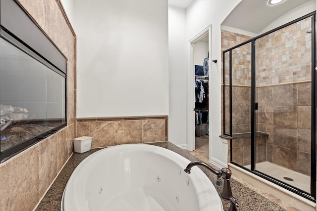 3063 Mitchell Way, The Colony, TX 75056 - bathroom featuring a stall shower, a tub with jets, and a walk in closet