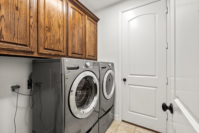 3063 Mitchell Way, The Colony, TX 75056 - washroom featuring cabinet space, washer and dryer, and light tile patterned flooring
