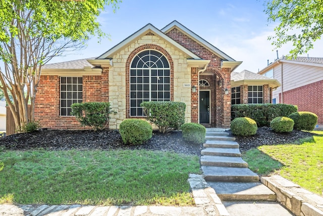 3601 Carmel Mountain Dr, Mckinney, TX 75070 - view of front of property with brick siding, a front yard, and roof with shingles