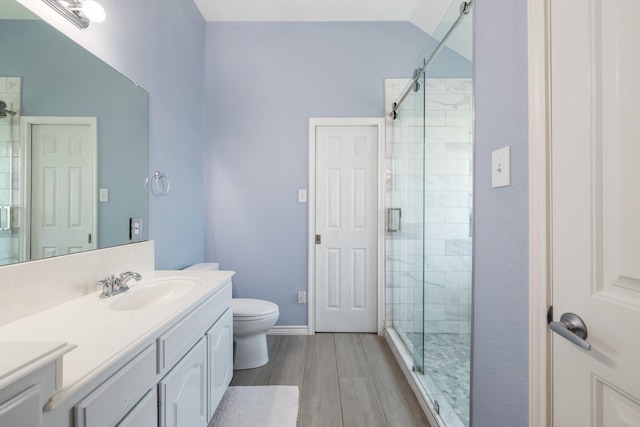 3601 Carmel Mountain Dr, Mckinney, TX 75070 - full bath with a stall shower, vanity, wood finished floors, and toilet