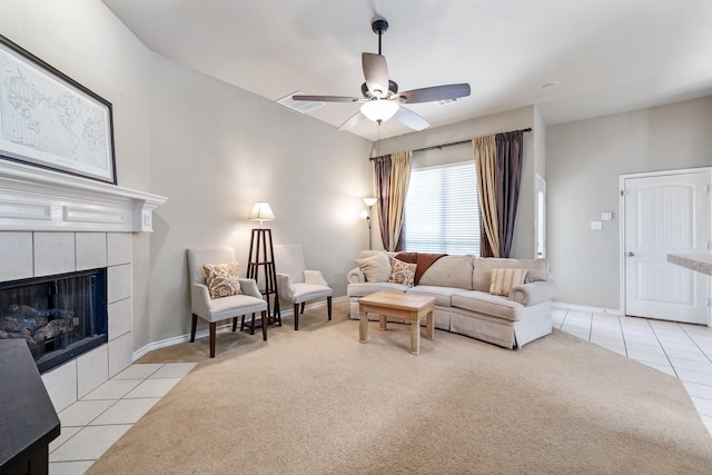 3601 Carmel Mountain Dr, Mckinney, TX 75070 - carpeted living room with ceiling fan, a fireplace, tile patterned floors, and baseboards