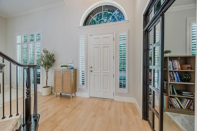 513 Suncreek Dr, Allen, TX 75013 - foyer featuring wood finished floors, plenty of natural light, ornamental molding, and baseboards