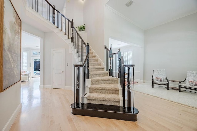 513 Suncreek Dr, Allen, TX 75013 - stairs with wood finished floors, plenty of natural light, crown molding, baseboards, and a high ceiling