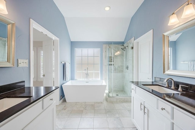 513 Suncreek Dr, Allen, TX 75013 - full bath featuring lofted ceiling, a stall shower, two vanities, and a soaking tub