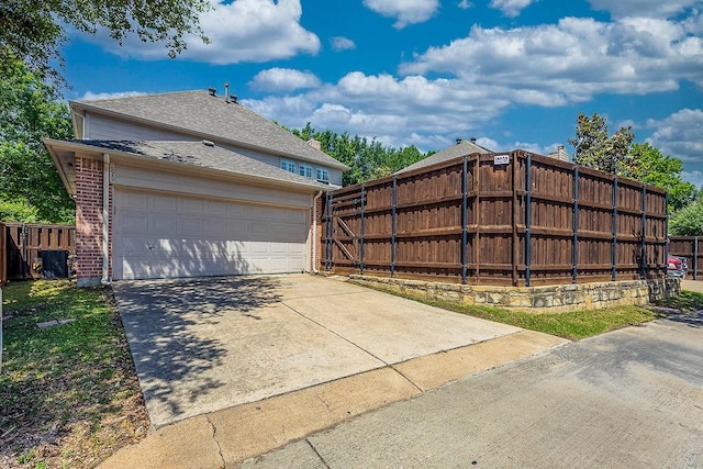 513 Suncreek Dr, Allen, TX 75013 - garage featuring fence, concrete driveway, and cooling unit