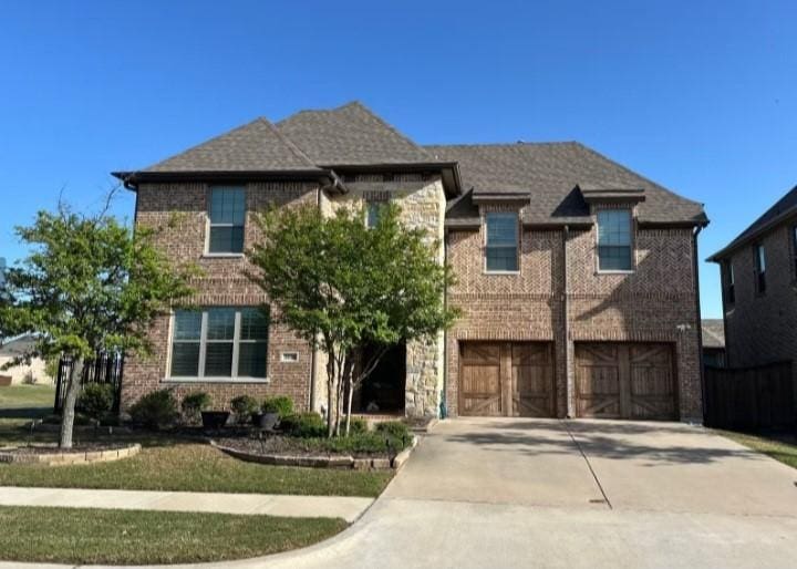 3616 Ashley Gdns, The Colony, TX 75056 - view of front of property with an attached garage, concrete driveway, and brick siding