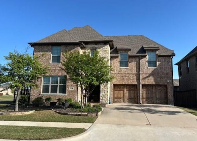 3616 Ashley Gdns, The Colony, TX 75056 - view of front of property with an attached garage, concrete driveway, and brick siding