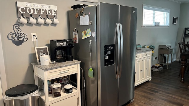 501 Linda Kay Dr, Winnsboro, TX 75494 - kitchen with stainless steel fridge, dark wood finished floors, white cabinetry, ornamental molding, and light stone counters