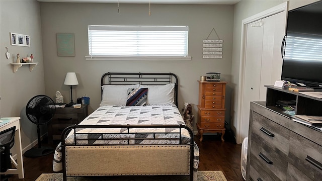 501 Linda Kay Dr, Winnsboro, TX 75494 - bedroom featuring dark wood-type flooring, a closet, and baseboards