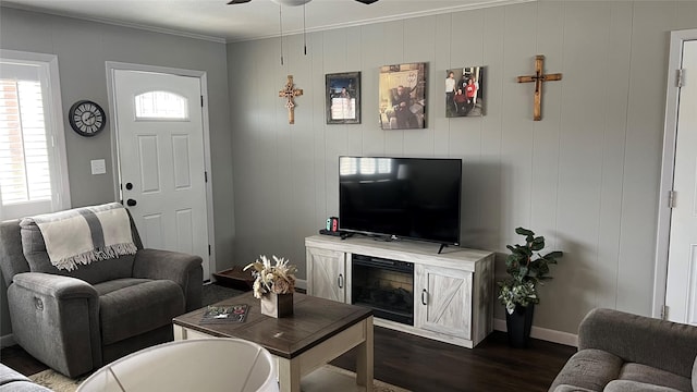 501 Linda Kay Dr, Winnsboro, TX 75494 - living room featuring dark wood-style flooring, ceiling fan, ornamental molding, and baseboards