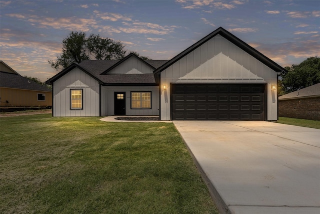 1612 Cheyenne Trl, Granbury, TX 76048 - view of front of house with board and batten siding, a garage, driveway, and a front lawn