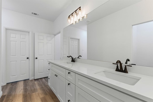 1612 Cheyenne Trl, Granbury, TX 76048 - bathroom featuring double vanity and wood finished floors