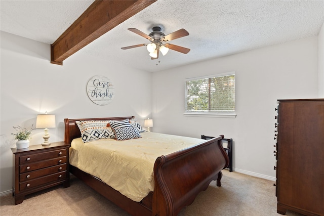 107 Nob Hill Cir, Malakoff, TX 75148 - bedroom featuring light carpet, a textured ceiling, beamed ceiling, baseboards, and a ceiling fan