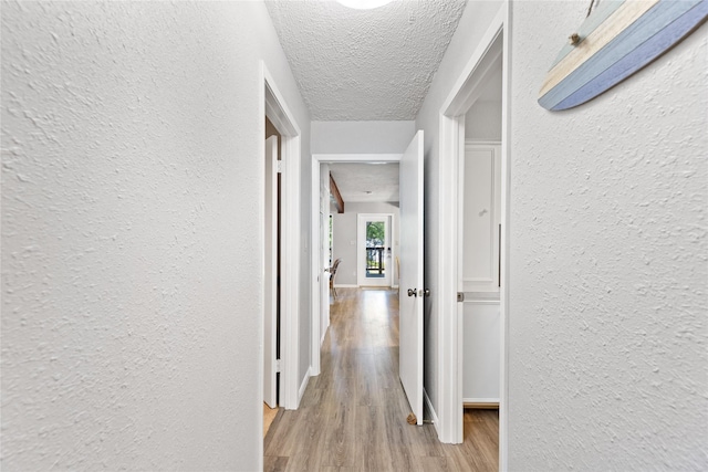 107 Nob Hill Cir, Malakoff, TX 75148 - hall with a textured wall, light wood finished floors, and a textured ceiling
