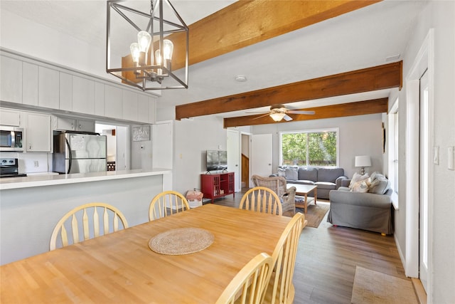 107 Nob Hill Cir, Malakoff, TX 75148 - dining area with beamed ceiling, wood finished floors, a chandelier, and ceiling fan