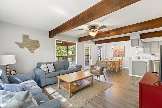 107 Nob Hill Cir, Malakoff, TX 75148 - living area with baseboards, light wood-type flooring, ceiling fan, and beamed ceiling