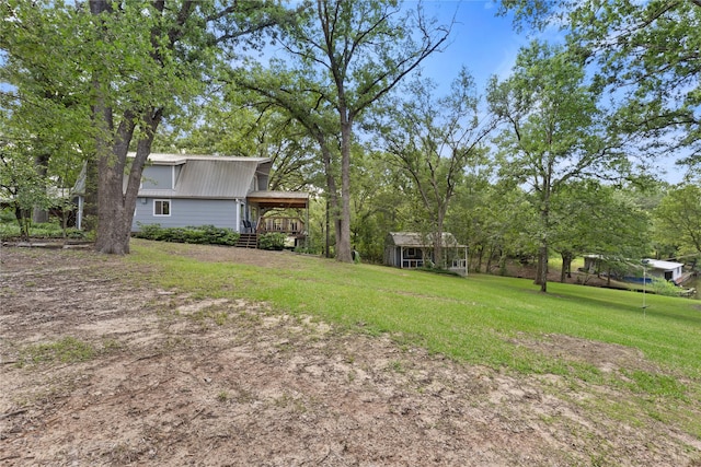 107 Nob Hill Cir, Malakoff, TX 75148 - view of grassy yard featuring an outbuilding and a deck