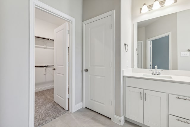 2929 Galveston St, Plano, TX 75075 - bathroom with vanity, baseboards, and a spacious closet