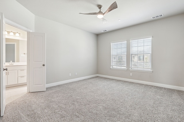 2929 Galveston St, Plano, TX 75075 - spare room with a sink, a ceiling fan, light colored carpet, and baseboards