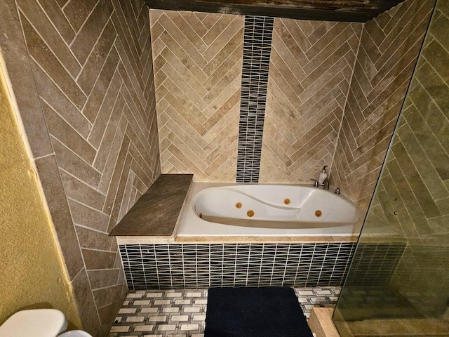 2404 Handley Dr, Fort Worth, TX 76112 - bathroom featuring a tub with jets, a tile shower, tile walls, and toilet