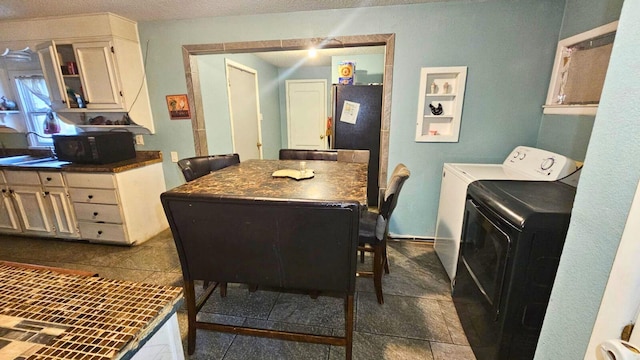 2404 Handley Dr, Fort Worth, TX 76112 - dining space with washer and clothes dryer and a textured ceiling