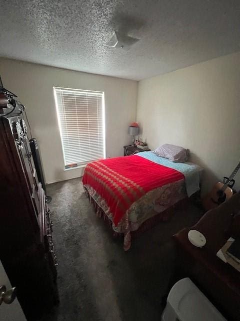 carpeted bedroom with a textured ceiling