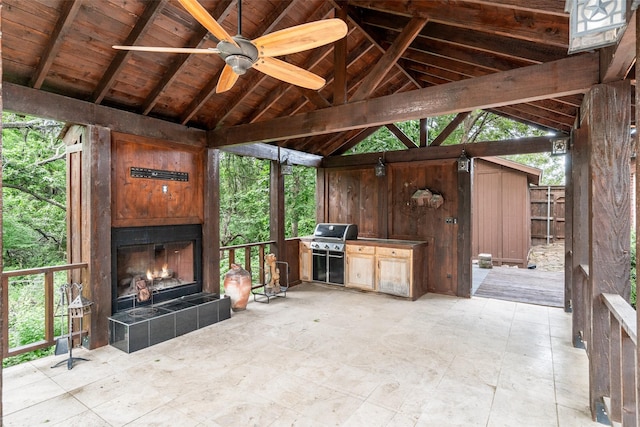 1201 Tralee Ln, Garland, TX 75044 - view of patio with a tiled fireplace, ceiling fan, and area for grilling