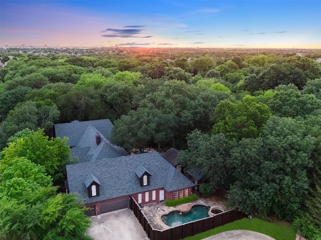 1201 Tralee Ln, Garland, TX 75044 - aerial view at dusk of a view of trees and view of pool area