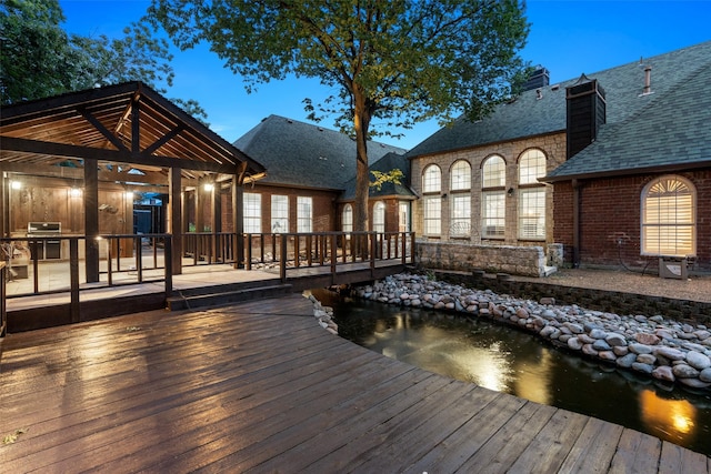 1201 Tralee Ln, Garland, TX 75044 - wooden terrace with a gazebo and exterior kitchen