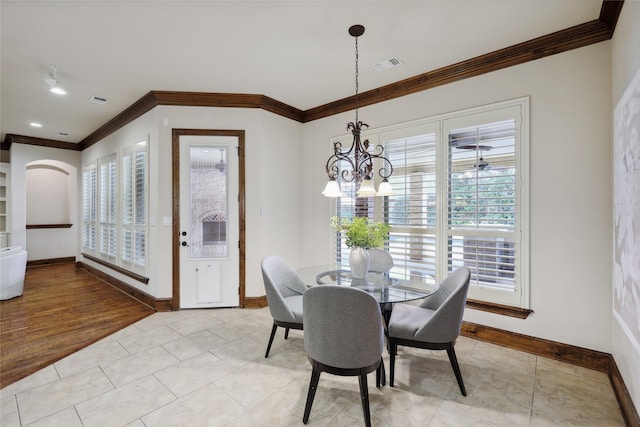 3316 Fairway Dr, Denton, TX 76226 - dining area featuring crown molding, baseboards, a chandelier, and light tile patterned floors