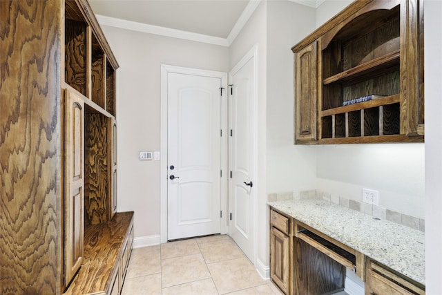 3316 Fairway Dr, Denton, TX 76226 - mudroom with ornamental molding, light tile patterned flooring, and baseboards