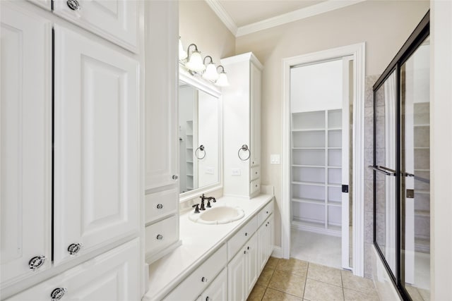 3316 Fairway Dr, Denton, TX 76226 - full bath featuring ornamental molding, a stall shower, vanity, tile patterned flooring, and a spacious closet