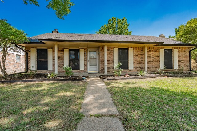 9406 Shipman St, Rowlett, TX 75088 - single story home with a chimney, a front yard, and brick siding