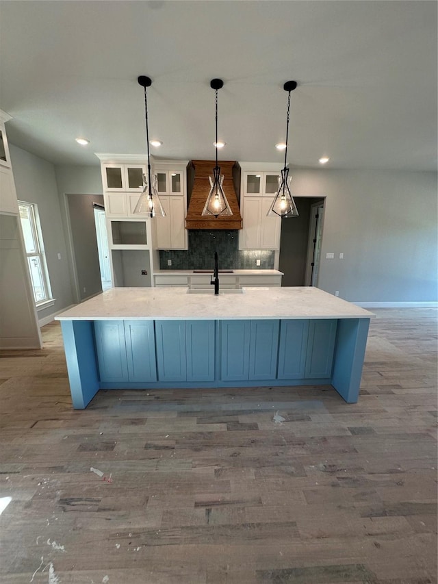 544 Aermotor Loop, Weatherford, TX 76085 - kitchen featuring custom exhaust hood, white cabinets, light wood-style flooring, and recessed lighting