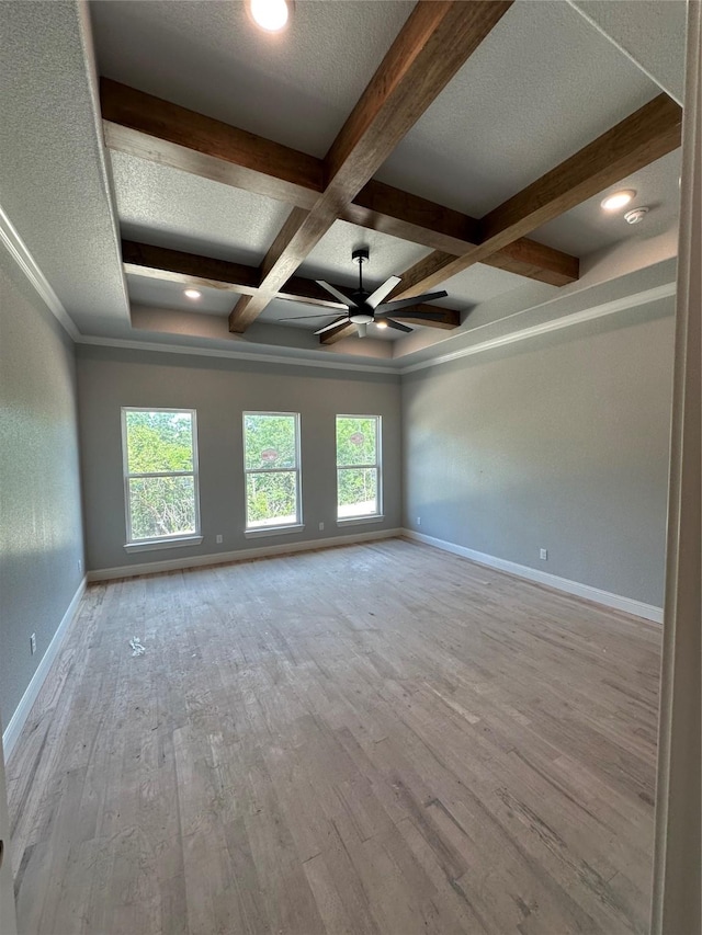 544 Aermotor Loop, Weatherford, TX 76085 - unfurnished room with wood finished floors, beam ceiling, coffered ceiling, ceiling fan, and baseboards