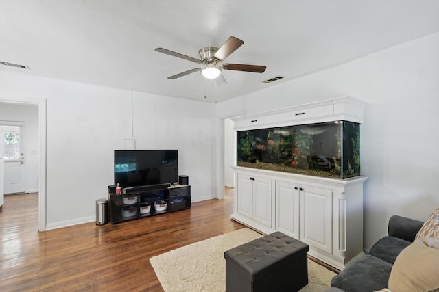 7348 Pensacola Ave, Fort Worth, TX 76116 - living area featuring wood finished floors, a ceiling fan, and baseboards