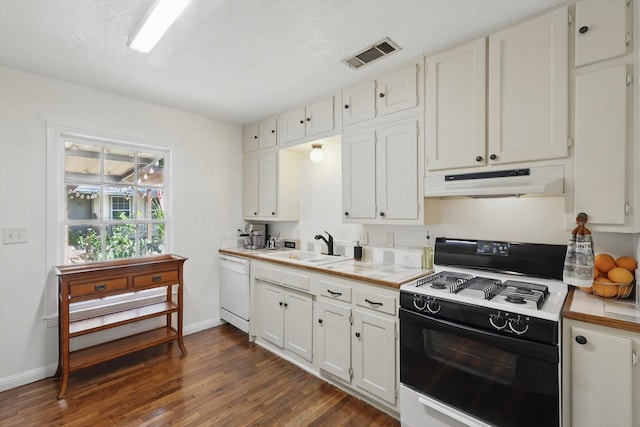 7348 Pensacola Ave, Fort Worth, TX 76116 - kitchen featuring black gas range oven, under cabinet range hood, tile countertops, dishwasher, and dark wood-style flooring