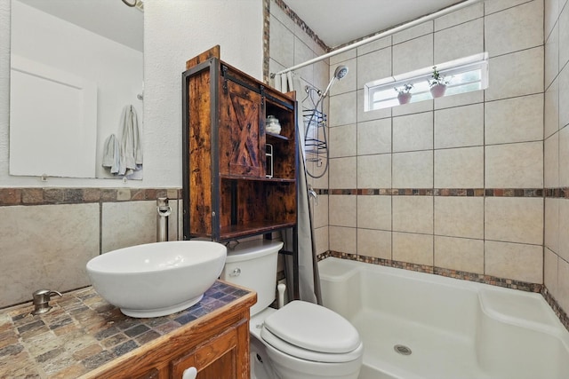 7348 Pensacola Ave, Fort Worth, TX 76116 - full bath with a shower with shower curtain, toilet, vanity, and tile walls