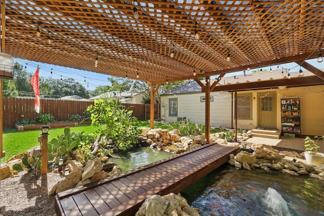 7348 Pensacola Ave, Fort Worth, TX 76116 - view of patio / terrace with fence, a pergola, and a small pond
