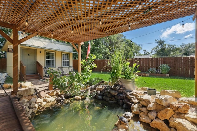 7348 Pensacola Ave, Fort Worth, TX 76116 - view of patio featuring a small pond, a pergola, and an outbuilding