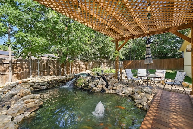 7348 Pensacola Ave, Fort Worth, TX 76116 - view of patio with a garden pond, a fenced backyard, and a pergola